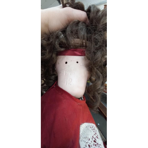 1279 - A large Edwardian bisque headed  doll marked 1916, 12 on back of head