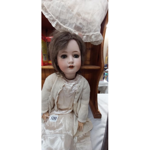 1280 - A Victorian bisque head doll, makers mark is feint