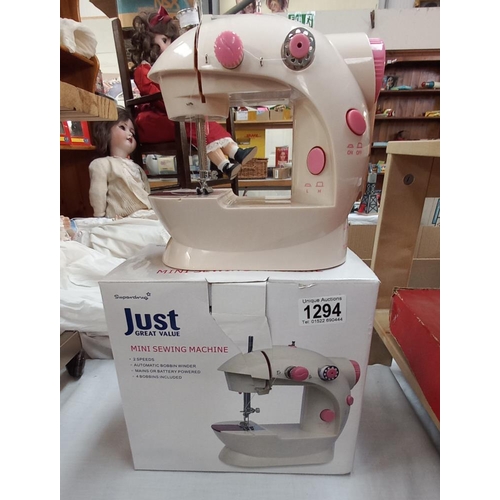 1294 - A boxed child's mini sewing machine