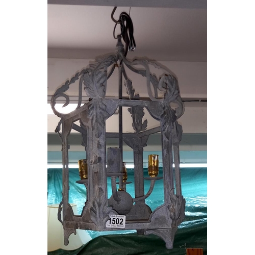 1502 - A wrought iron exterior porch lantern, (no glass) COLLECT ONLY