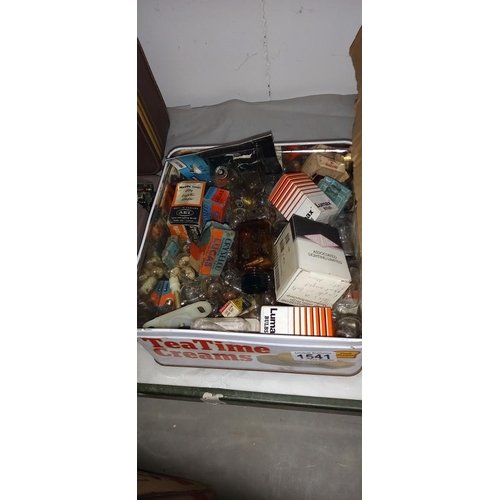 1541 - An old tin of car light bulbs & a box of vintage spark plugs and oil filters etc. COLLECT ONLY.