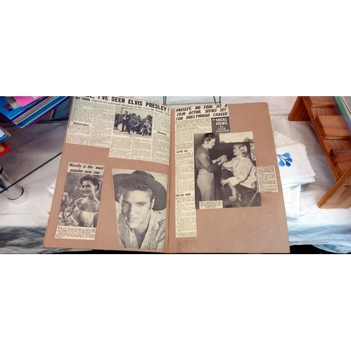 1559 - A quantity of Elvis scrap books and books