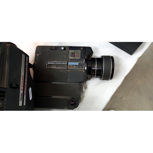 1802 - A sankyo macro focus. super MF-606 cine camera and a boxed Prinz super 8 Automatic protector (model ... 