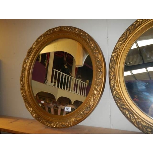 523 - A pair of good quality gilt framed circular mirrors. COLLECT ONLY.