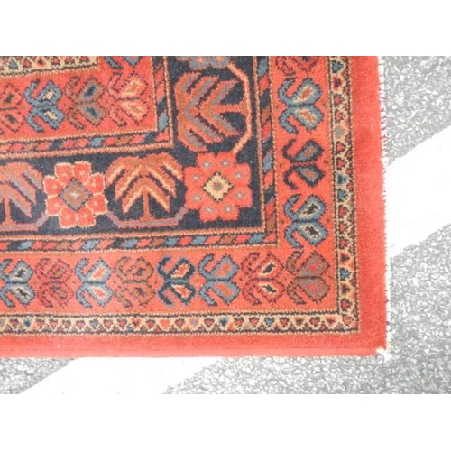 534 - A good red patterned rug, 96 x 67 inches, COLLECT ONLY.