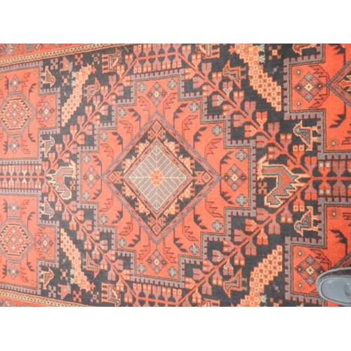 534 - A good red patterned rug, 96 x 67 inches, COLLECT ONLY.