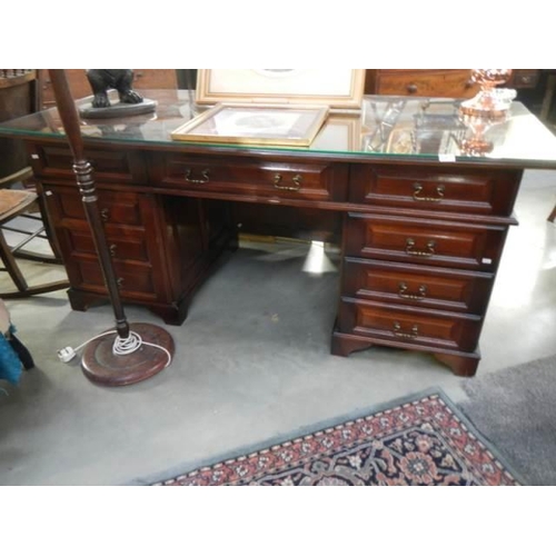 563 - A good quality mahogany double pedestal desk with glass top, COLLECT ONLY.