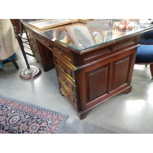 563 - A good quality mahogany double pedestal desk with glass top, COLLECT ONLY.