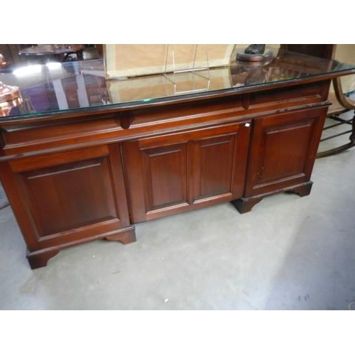 563 - A good quality mahogany double pedestal desk with glass top, COLLECT ONLY.