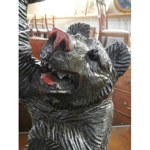 568 - A large carved wood  Black Forest bear plant stand, 53cm., COLLECT ONLY.