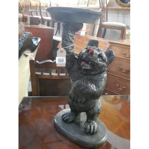 568 - A large carved wood  Black Forest bear plant stand, 53cm., COLLECT ONLY.