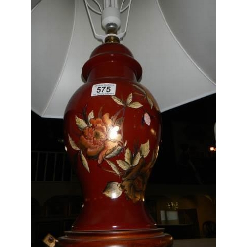 575 - A hand painted ceramic table lamp.