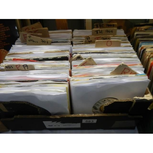 583 - Three boxes of 45 rpm records.