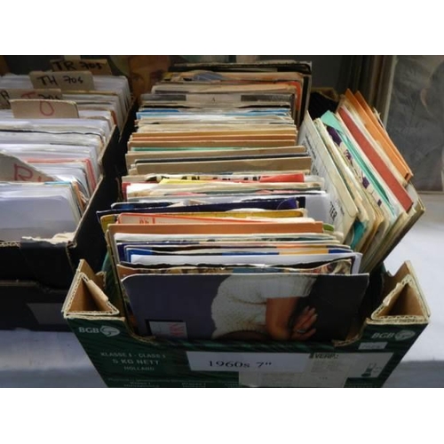 583 - Three boxes of 45 rpm records.