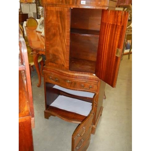 615 - A mid 20th century drinks cabinet with imitation drawer front to base. COLLECT ONLY.