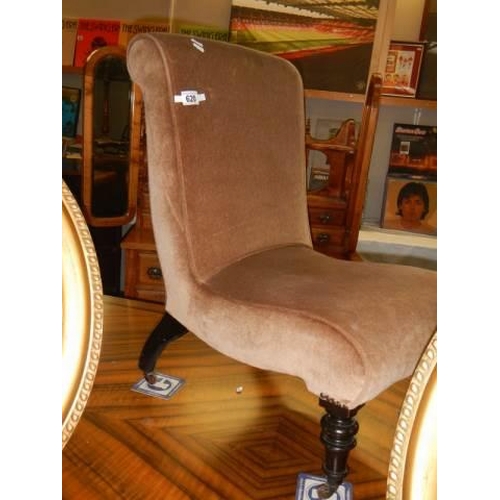 620 - An Edwardian nursing chair in castors, COLLECT ONLY.