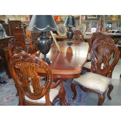 637 - A mahogany extending dining table with an extra lead and a set of 8 dining chairs, COLLECT ONLY.