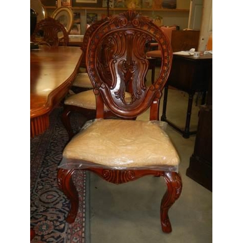 637 - A mahogany extending dining table with an extra lead and a set of 8 dining chairs, COLLECT ONLY.