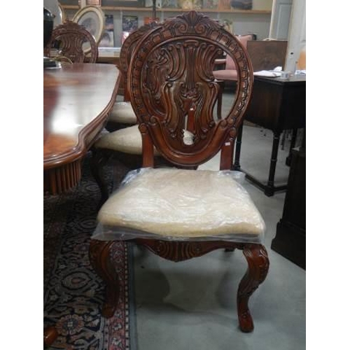 637 - A mahogany extending dining table with an extra lead and a set of 8 dining chairs, COLLECT ONLY.