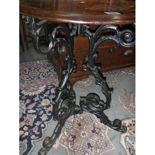 638 - A cast iron pub table with mahogany top, COLLECT ONLY.