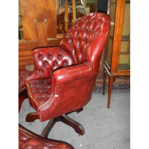 649 - A Good quality deep buttoned swivel chair in red, COLLECT ONLY.