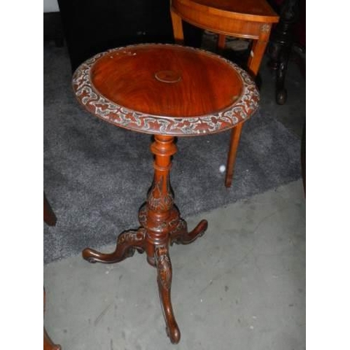 657 - A Victorian cabriole leg wine table with carved top. COLLECT ONLY.