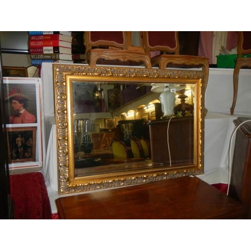 660 - A gilt framed bevel edged mirror, COLLECT ONLY.