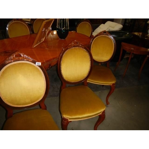 668 - A 10 foot French mahogany dining table with ten chairs, COLLECT ONLY.