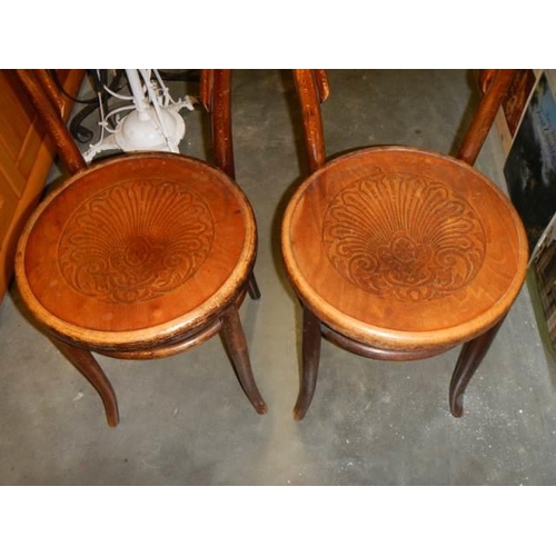 709 - A pair of bentwood chairs with poker work seats, COLLECT ONLY.