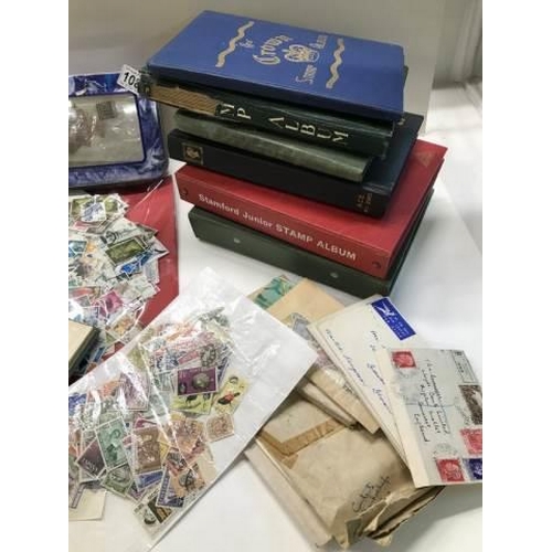 1080 - A box of assorted stamps in albums, loose and in envelopes.