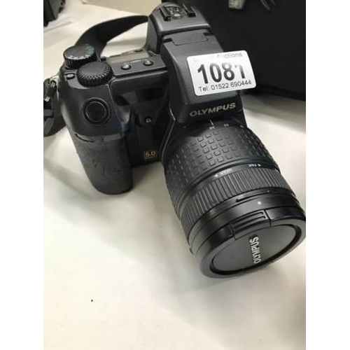 1081 - An Olympus digital camera with one extra lens and night vision scope (not tested).