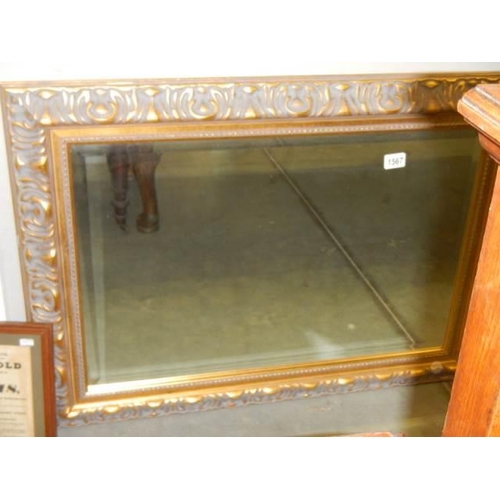 1567 - A 92 x 76 cm gilt framed bevel edged mirror, COLLECT ONLY.