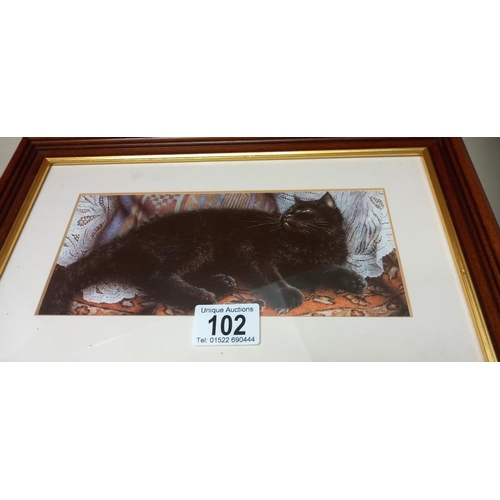 102 - A black Coalport cat figure and a framed and glazed black cat picture