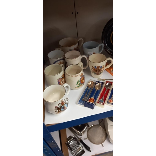 144 - A quantity of royalty commemorative ware, including plates, cups, spoons and a money box