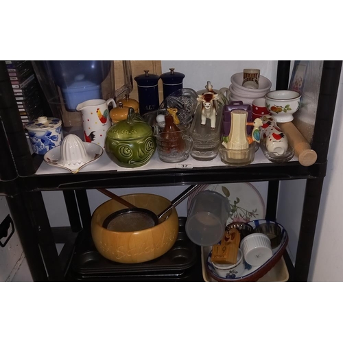 37 - A good lot of kitchenalia on 2 shelves including baking trays etc  COLLECT ONLY