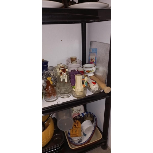 37 - A good lot of kitchenalia on 2 shelves including baking trays etc  COLLECT ONLY