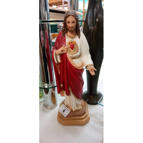 4 - A figure of Jesus and 1 other figure