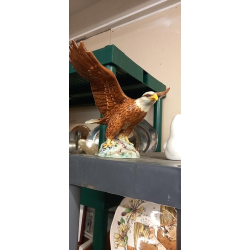 56 - A Beswick golden eagle (foot a/f but sympathetic repair) and a Requena dove