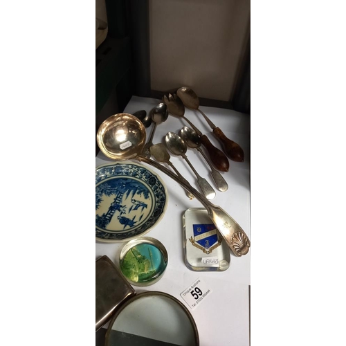 59 - A mixed lot including paperweights, large ladle etc