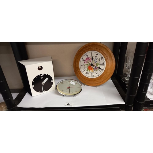 64 - A modern cuckoo clock, wall clock and a vintage alarm clock