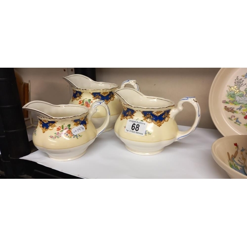 68 - 3 vintage graduated jugs by Grindley