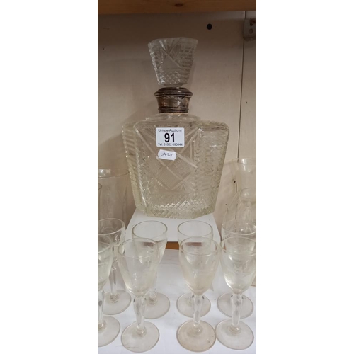 91 - A quantity of old drinking glasses and a decanter with silver neck, stopper is a/f