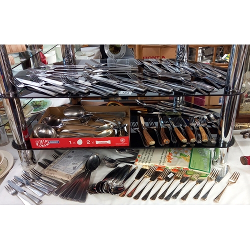 164 - A good lot of cutlery including some sets