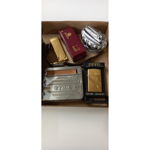 191 - A vintage Dunhill empty lighter box, Zippo lighter etc plus Rotary quartz watch and old tin