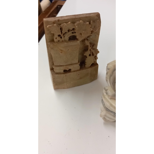 197 - A pair of alabaster bookends and an alabaster dish (chipped on edge)