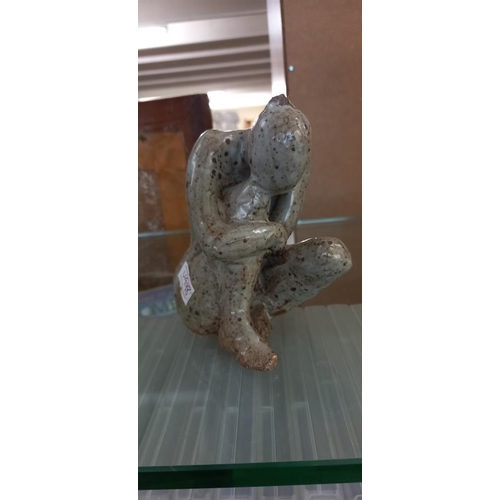 233 - A modern art metal sculpture & a Studio pottery seated figure