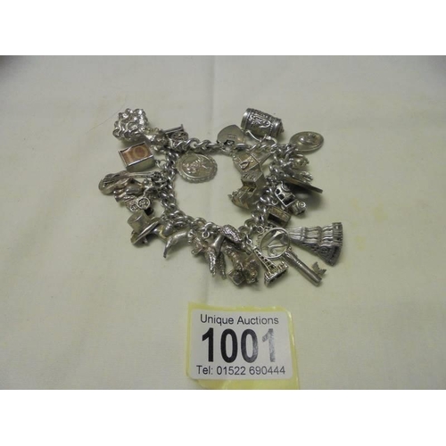 1001 - A four ounce silver charm bracelet.