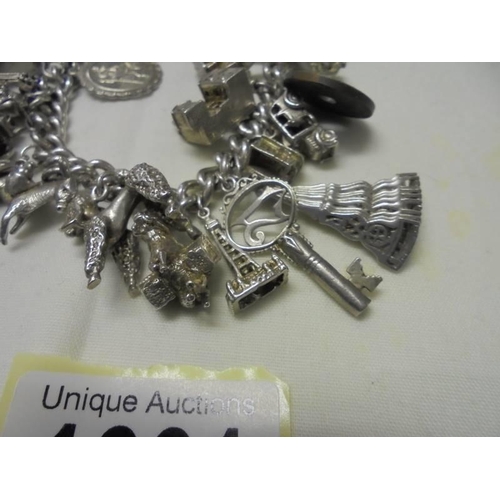 1001 - A four ounce silver charm bracelet.