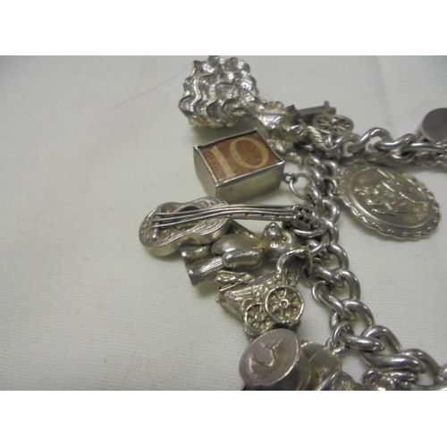 1001 - A four ounce silver charm bracelet.