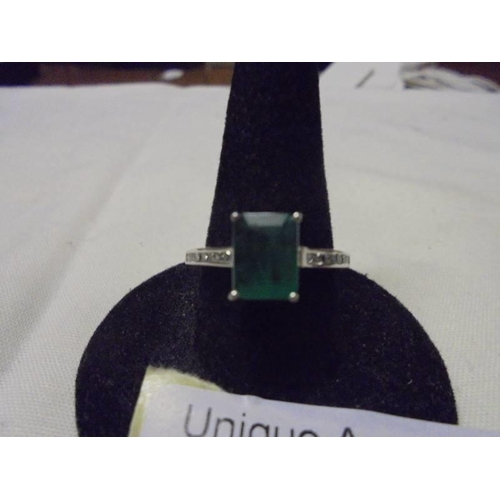 1005 - An 18ct white gold emerald and diamond ring, size L half, 2.9 grams.